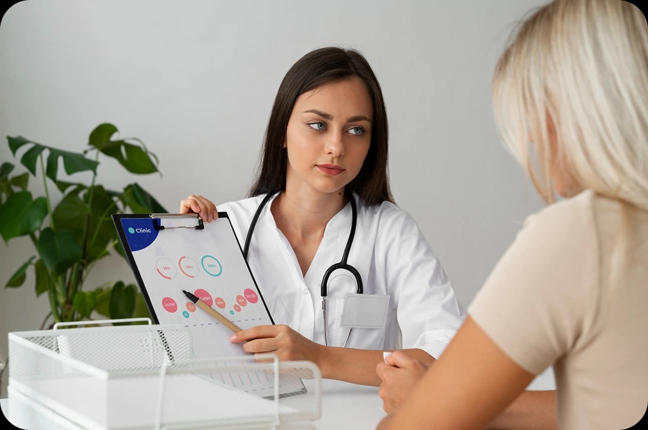 Doctor reviewing a treatment plan on a tablet with a patient