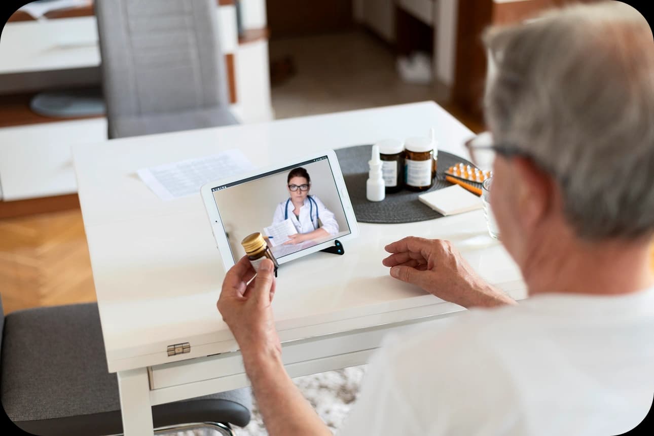 Patient on a virtual visit with a doctor on a tablet