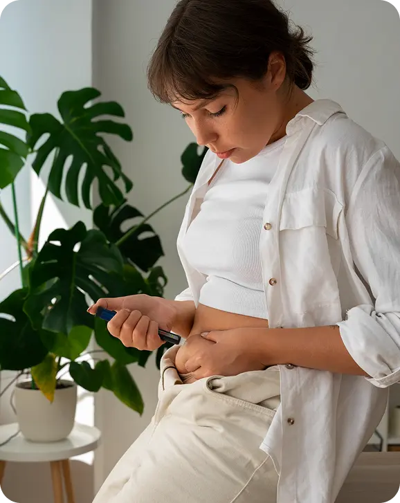 An Ongo clinician reviewing a weight loss dashboard and GLP-1 medications with a patient
